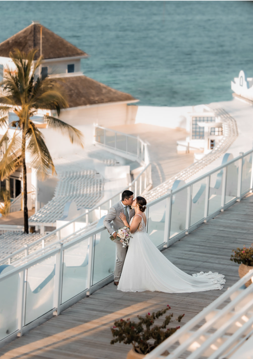 Newlyweds at Beaches Ocho Rios wedding reception, surrounded by tropical beauty