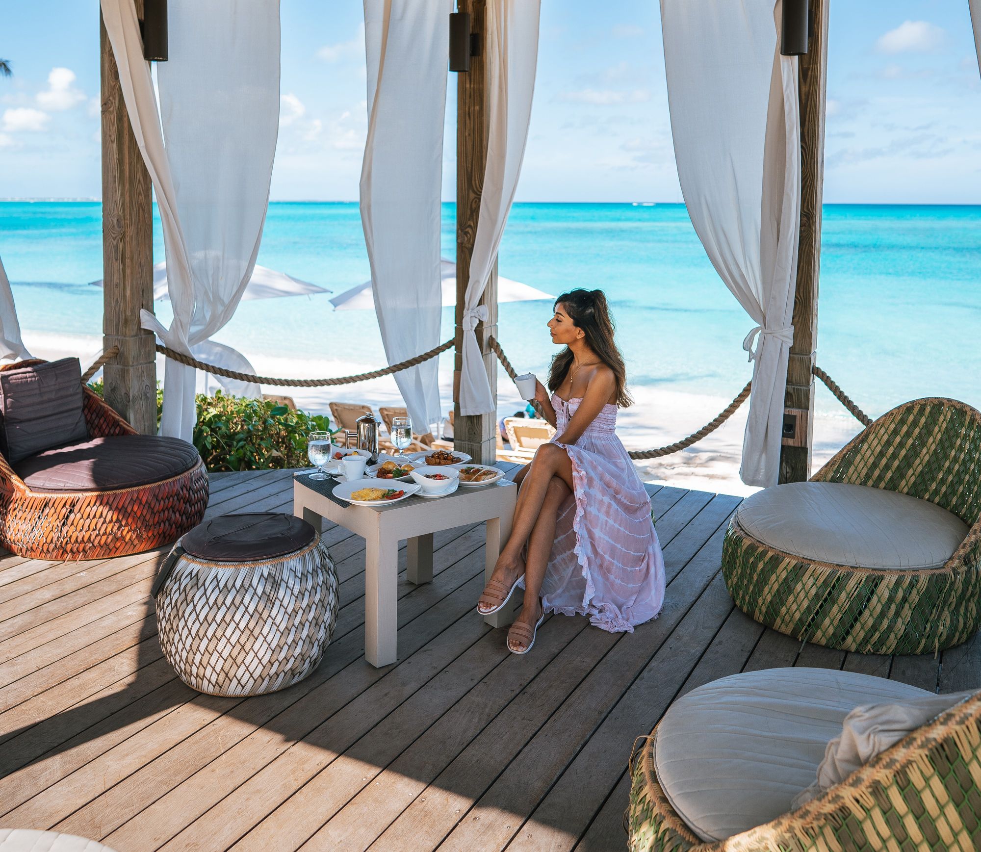 woman dining by the sea