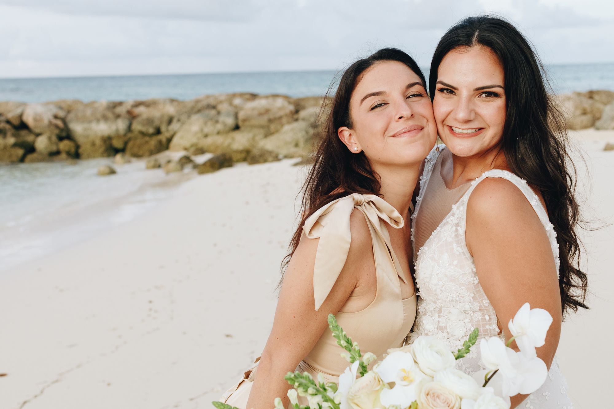 bride on beach with friend